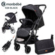 Monbebe 535 black baby stroller with foldable design and matching diaper bag